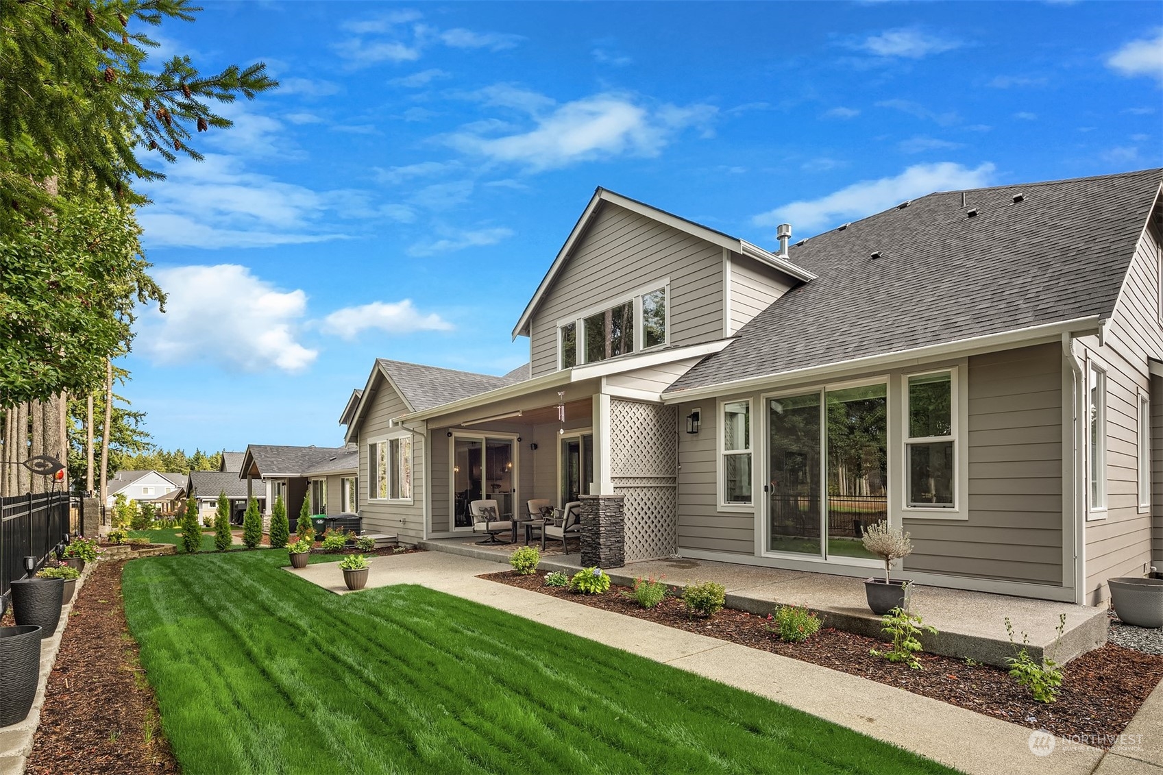 4331 Caddyshack Drive Northeast Lacey, WA 98516 - Photo 31 of 34 a front view of a house with a yard