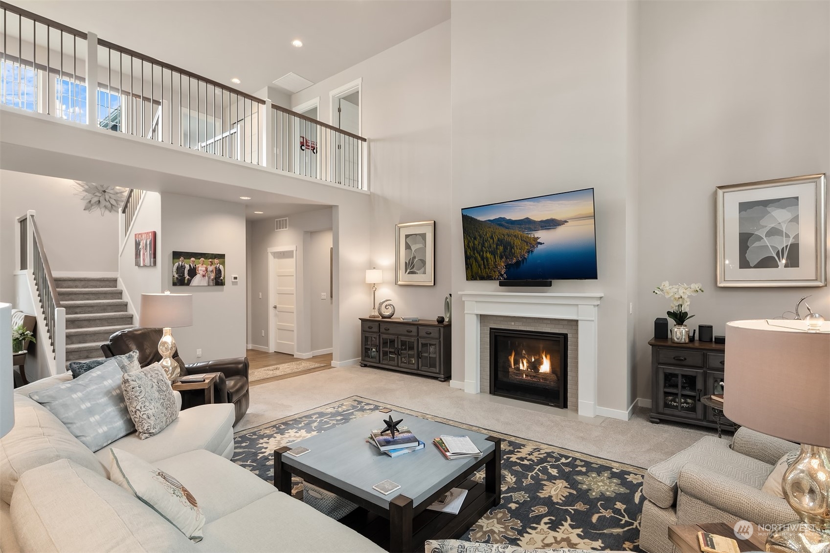 4331 Caddyshack Drive Northeast Lacey, WA 98516 - Photo 4 of 34 a living room with furniture a flat screen tv and a fireplace