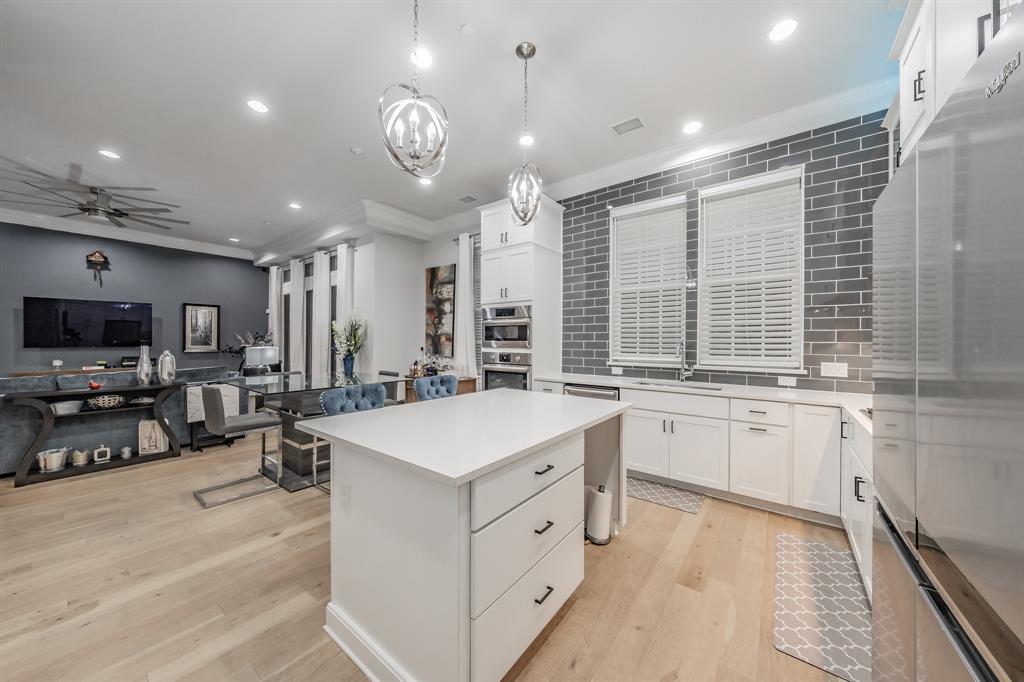 7333 Valley View Lane, Unit 902 Dallas, TX 75240 - Photo 12 of 40 a large white kitchen with a large window