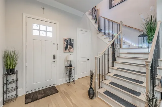 a kitchen with stainless steel appliances kitchen island granite countertop a refrigerator and microwave
