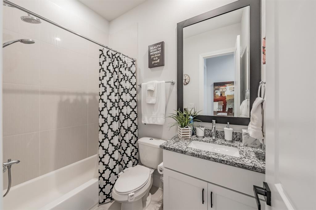 7333 Valley View Lane, Unit 902 Dallas, TX 75240 - Photo 29 of 40 a bathroom with a granite countertop sink toilet and shower