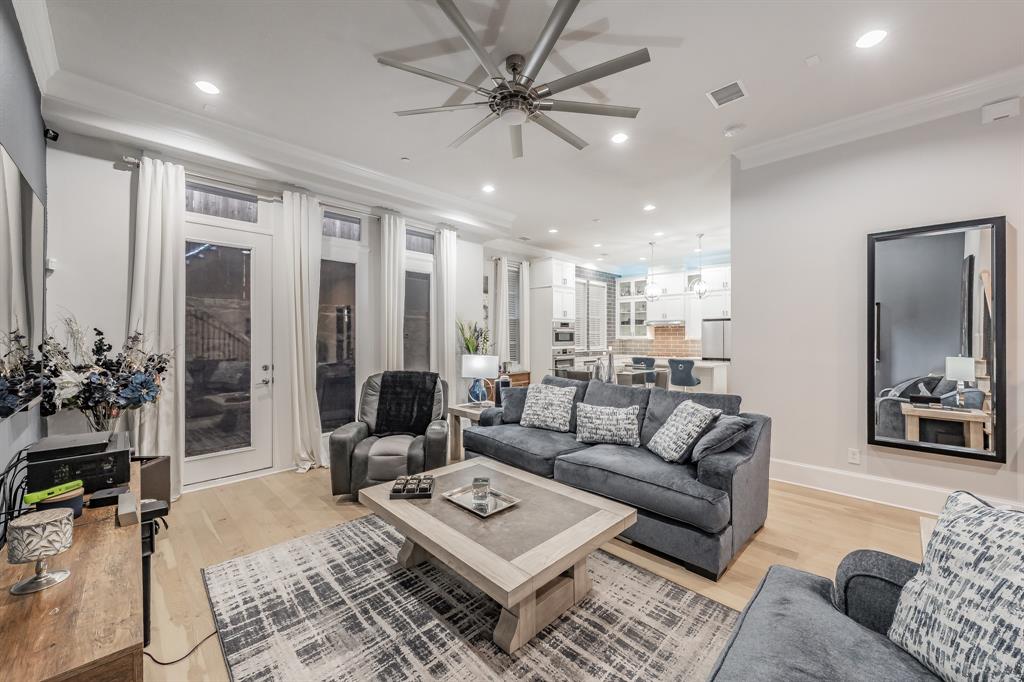 7333 Valley View Lane, Unit 902 Dallas, TX 75240 - Photo 4 of 40 a living room with furniture and wooden floor