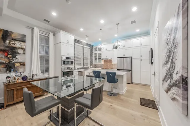 a room with gym equipment and a flat screen tv