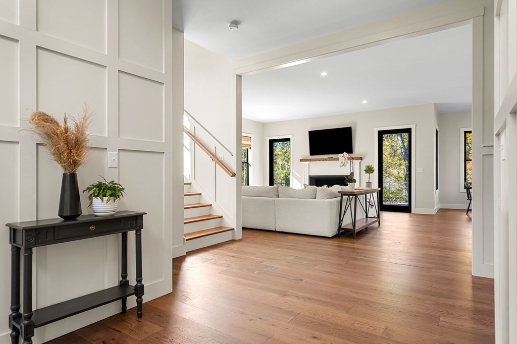 35 Hitching Post Road North Andover, MA 01845 - Photo 13 of 42 a living room with furniture and a flat screen tv