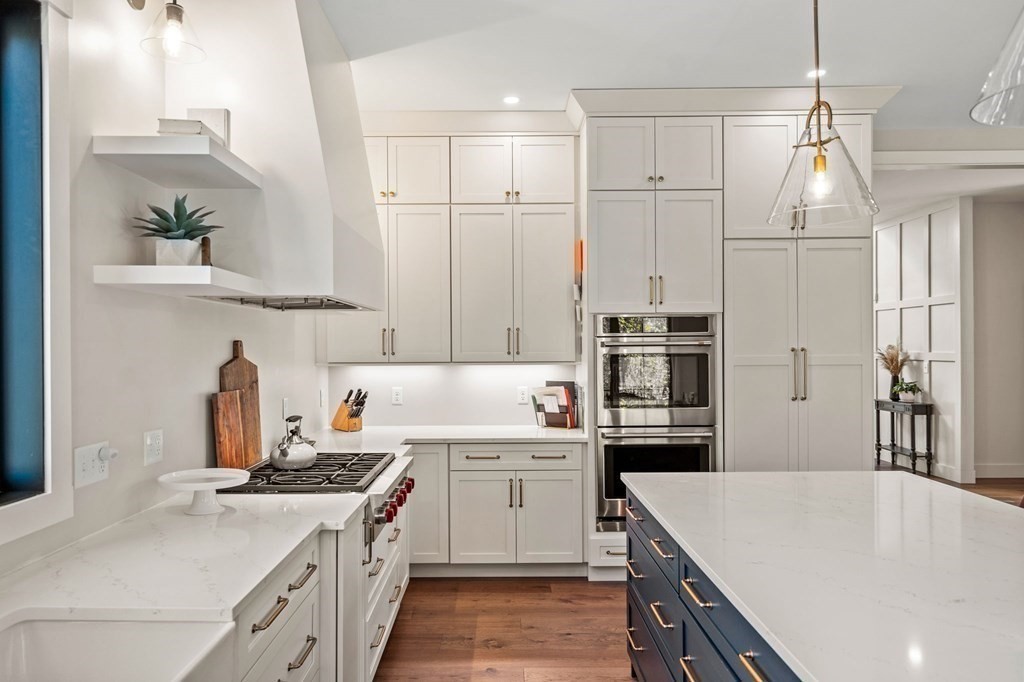 35 Hitching Post Road North Andover, MA 01845 - Photo 16 of 42 a kitchen with a stove a sink and a refrigerator