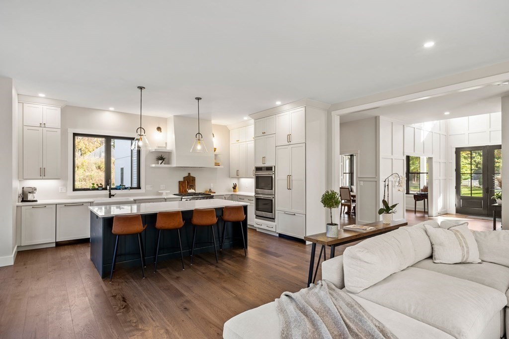 35 Hitching Post Road North Andover, MA 01845 - Photo 17 of 42 a living room with furniture a wooden floor and chandelier