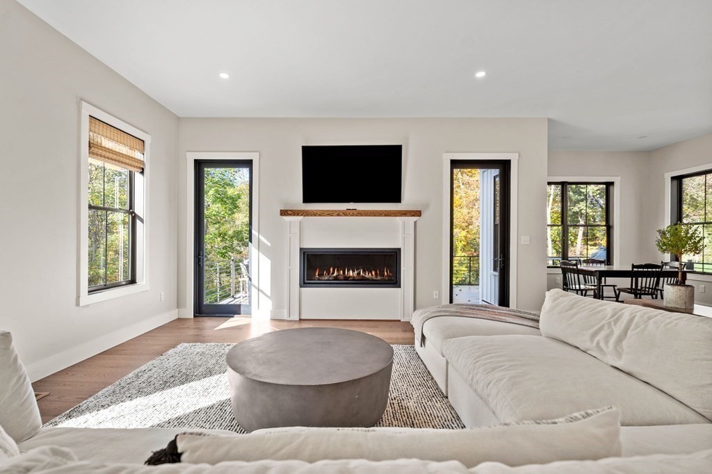 35 Hitching Post Road North Andover, MA 01845 - Photo 20 of 42 a living room with furniture and a fireplace