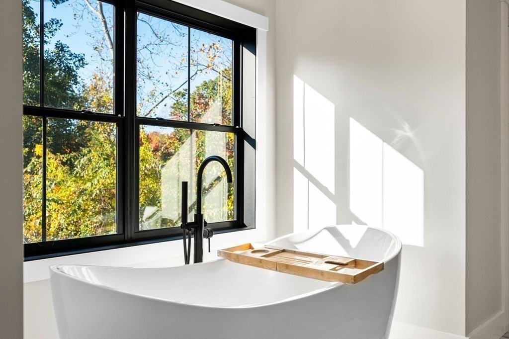 35 Hitching Post Road North Andover, MA 01845 - Photo 26 of 42 a bathroom with a sink and a window