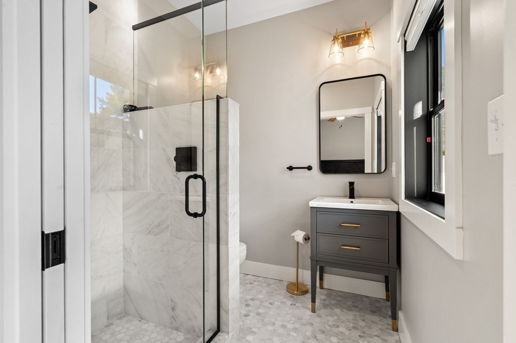 35 Hitching Post Road North Andover, MA 01845 - Photo 29 of 42 a bathroom with a double vanity sink mirror and shower