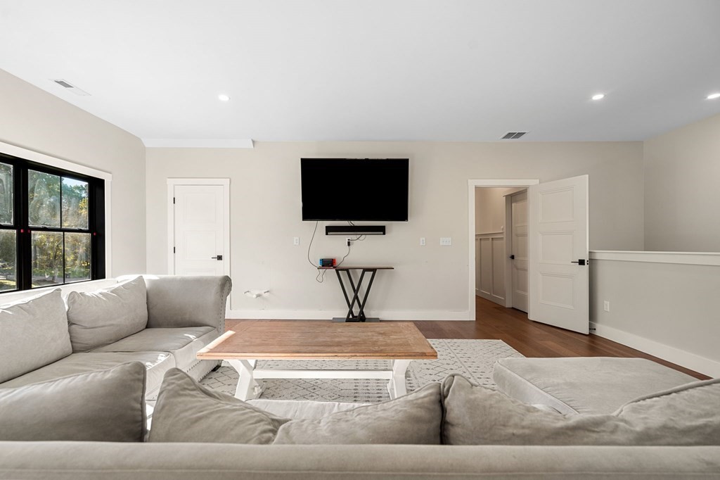 35 Hitching Post Road North Andover, MA 01845 - Photo 34 of 42 a living room with furniture and a flat screen tv