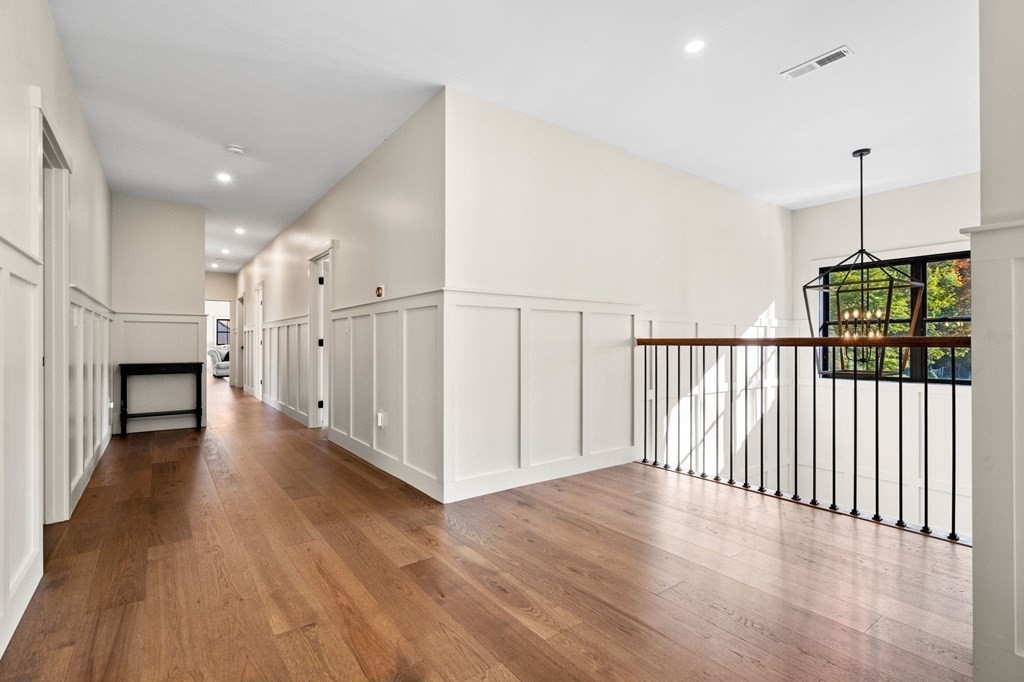 35 Hitching Post Road North Andover, MA 01845 - Photo 35 of 42 a view of a hallway with wooden floor