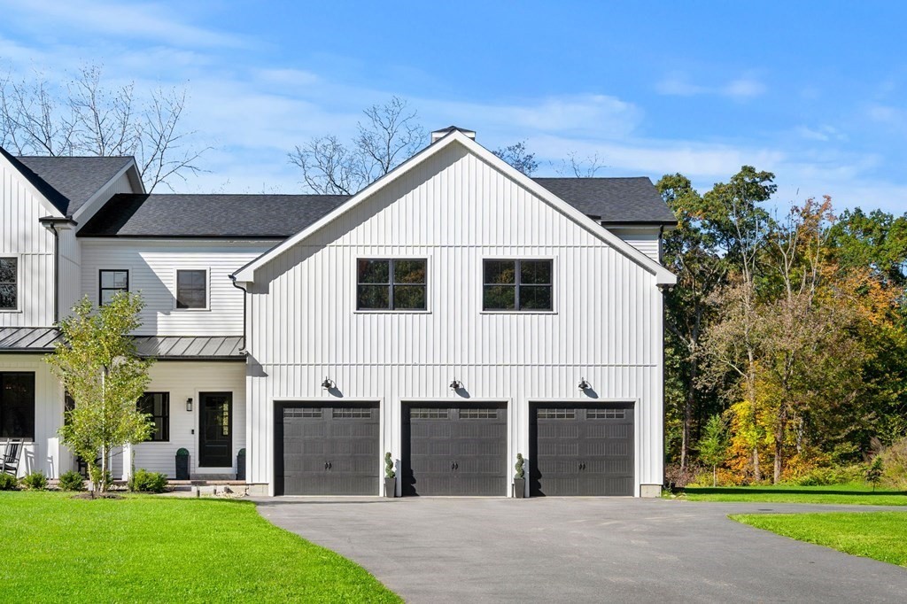 35 Hitching Post Road North Andover, MA 01845 - Photo 4 of 42 a view of a white house with a yard and potted plants