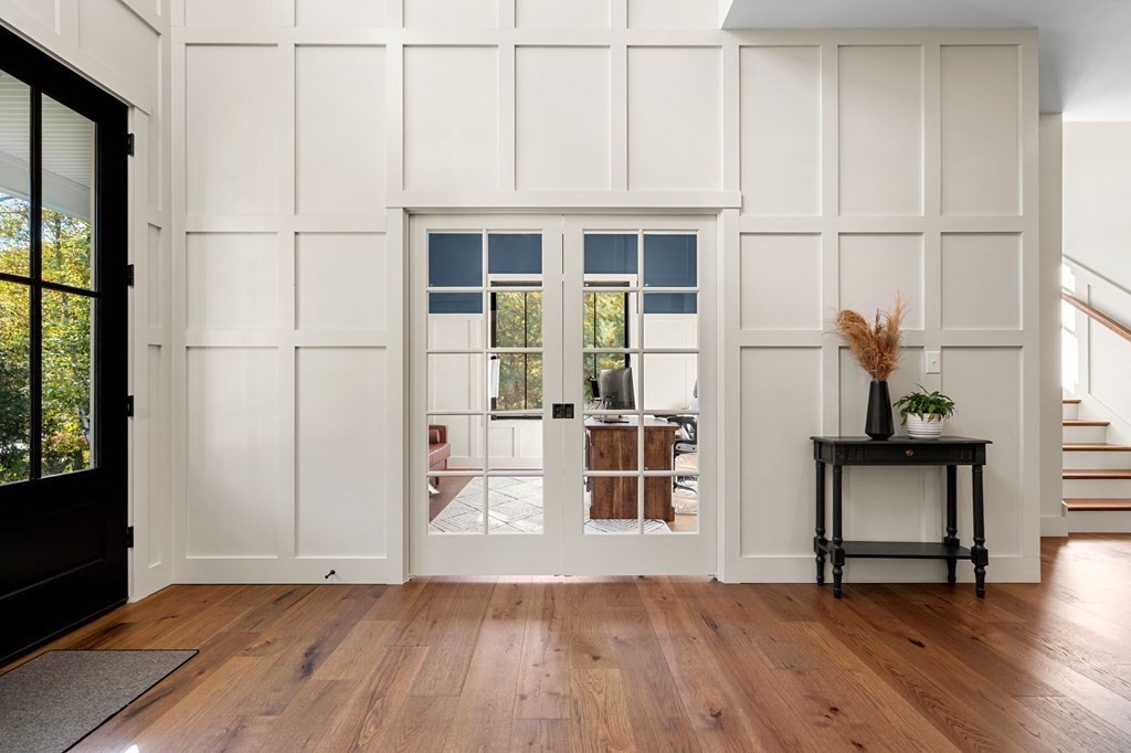 35 Hitching Post Road North Andover, MA 01845 - Photo 8 of 42 an empty room with wooden floor and windows