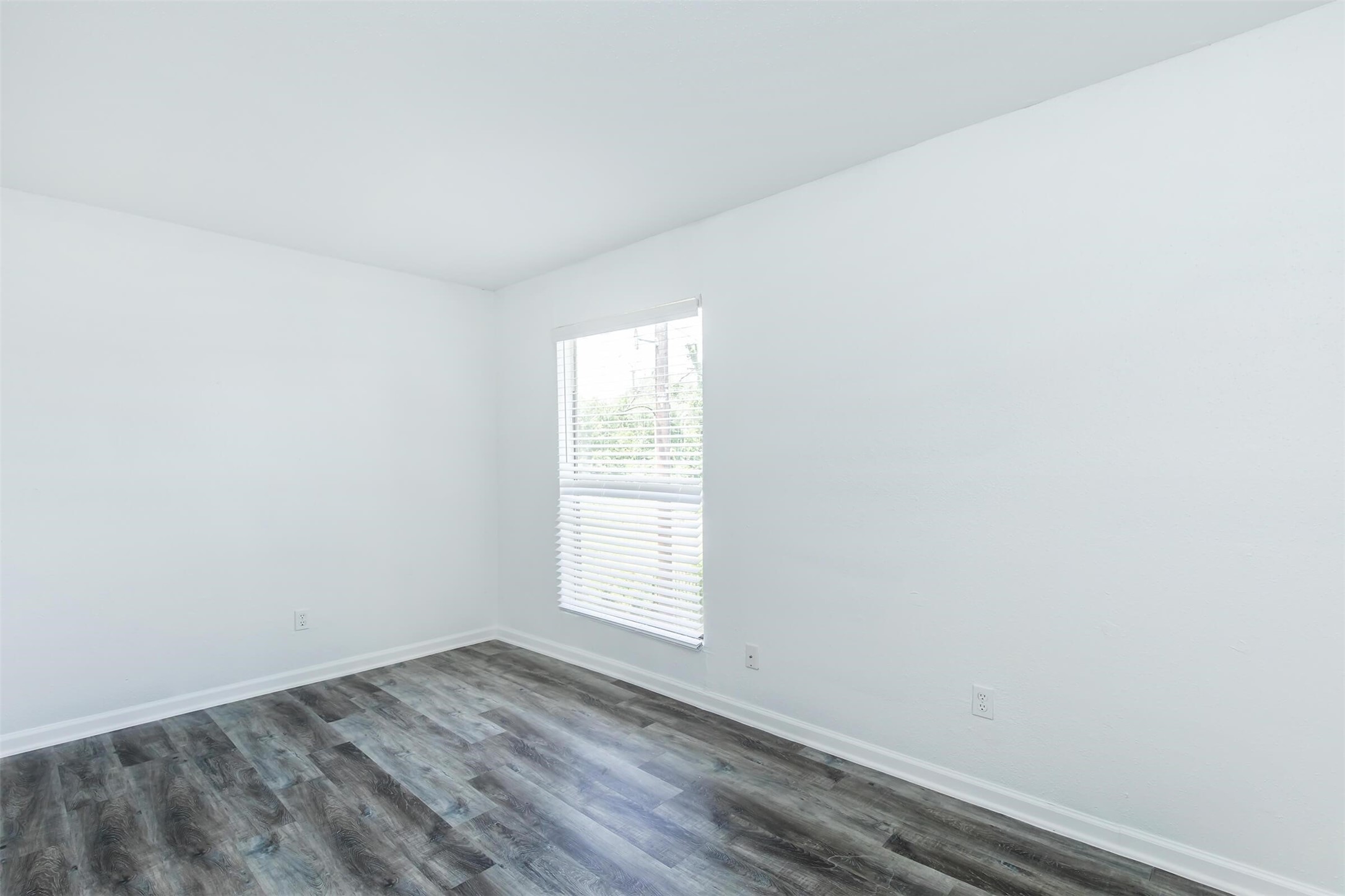 18001 Cypress Trace Road, Unit 201 Houston, TX 77090 - Photo 11 of 31 an empty room with a window