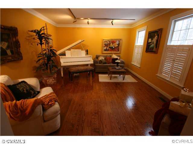 1900 Winterfield Road Midlothian, VA 23113 - Photo 3 of 12 a living room with furniture and a flat screen tv