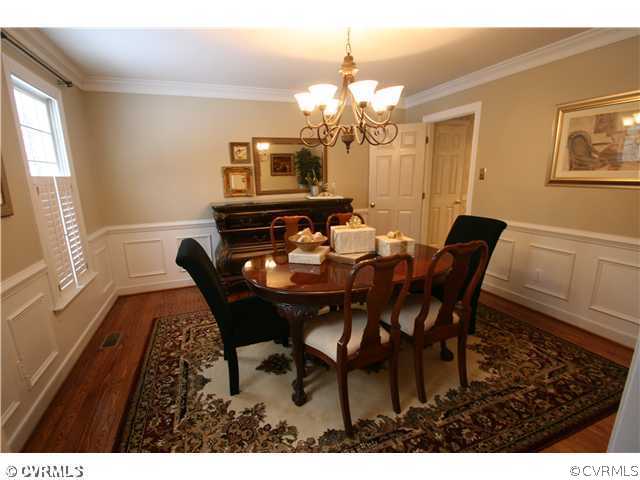 1900 Winterfield Road Midlothian, VA 23113 - Photo 4 of 12 a view of a dining room with furniture and a chandelier