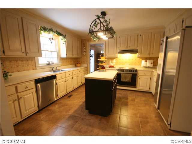1900 Winterfield Road Midlothian, VA 23113 - Photo 5 of 12 a kitchen with a sink stove and refrigerator
