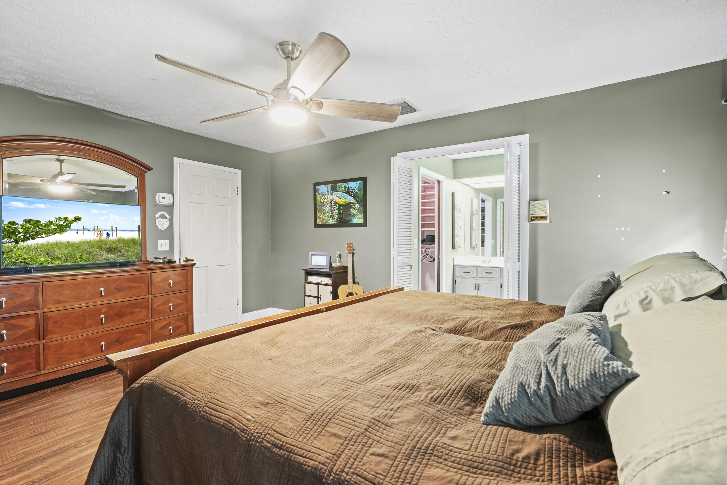 4170 McCarty Road Fort Pierce, FL 34945 - Photo 32 of 57 a bedroom with a large bed and a window