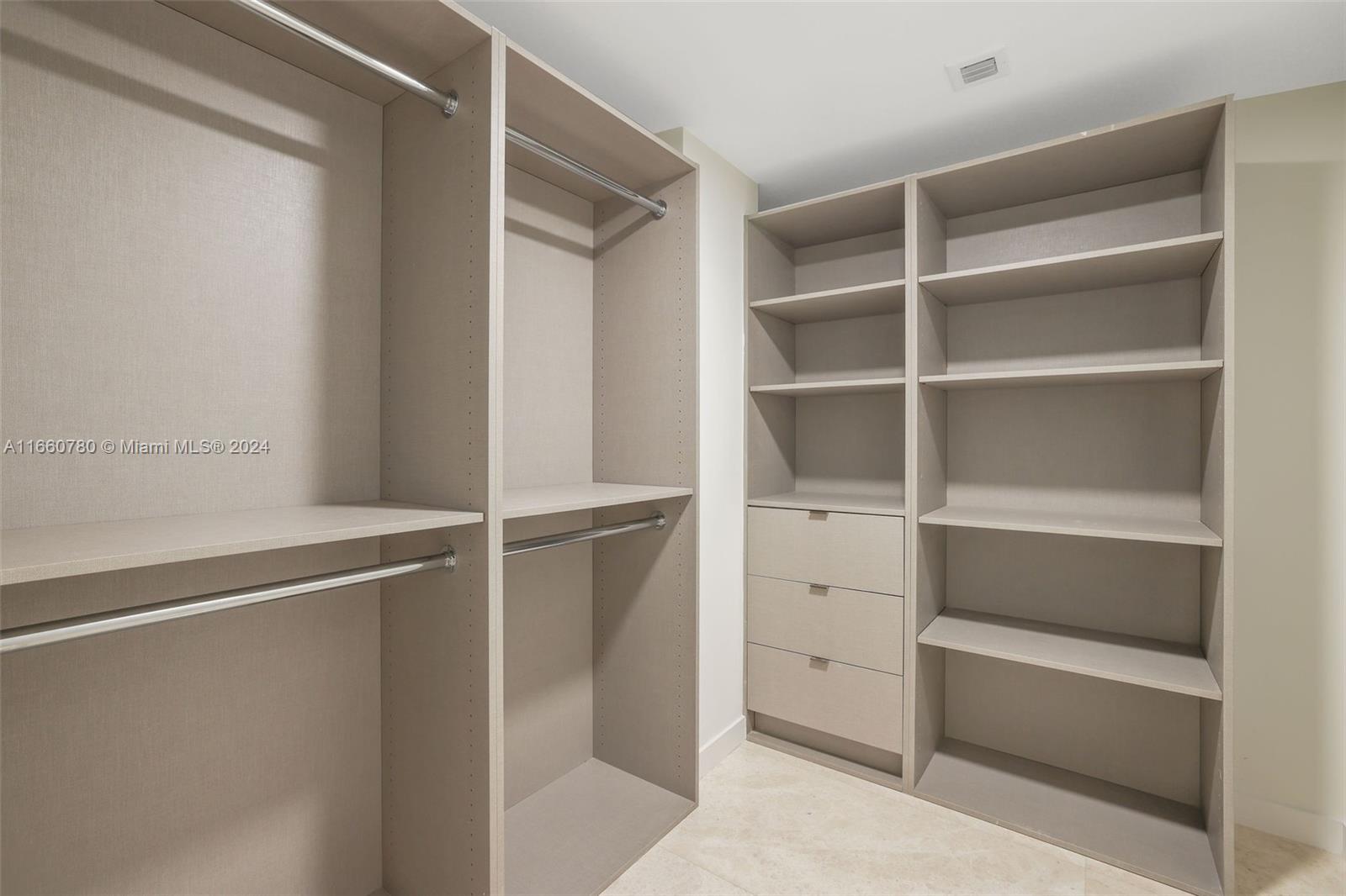 1500 Bay Road, Unit N0915 Miami Beach, FL 33139 - Photo 26 of 93 a view of an empty walk in closet