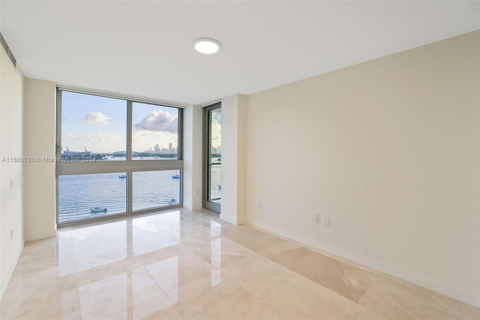1500 Bay Road, Unit N0915 Miami Beach, FL 33139 - Photo 27 of 93 a view of an empty room with a window