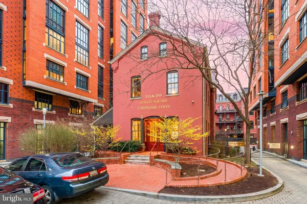 a view of a brick building with many windows