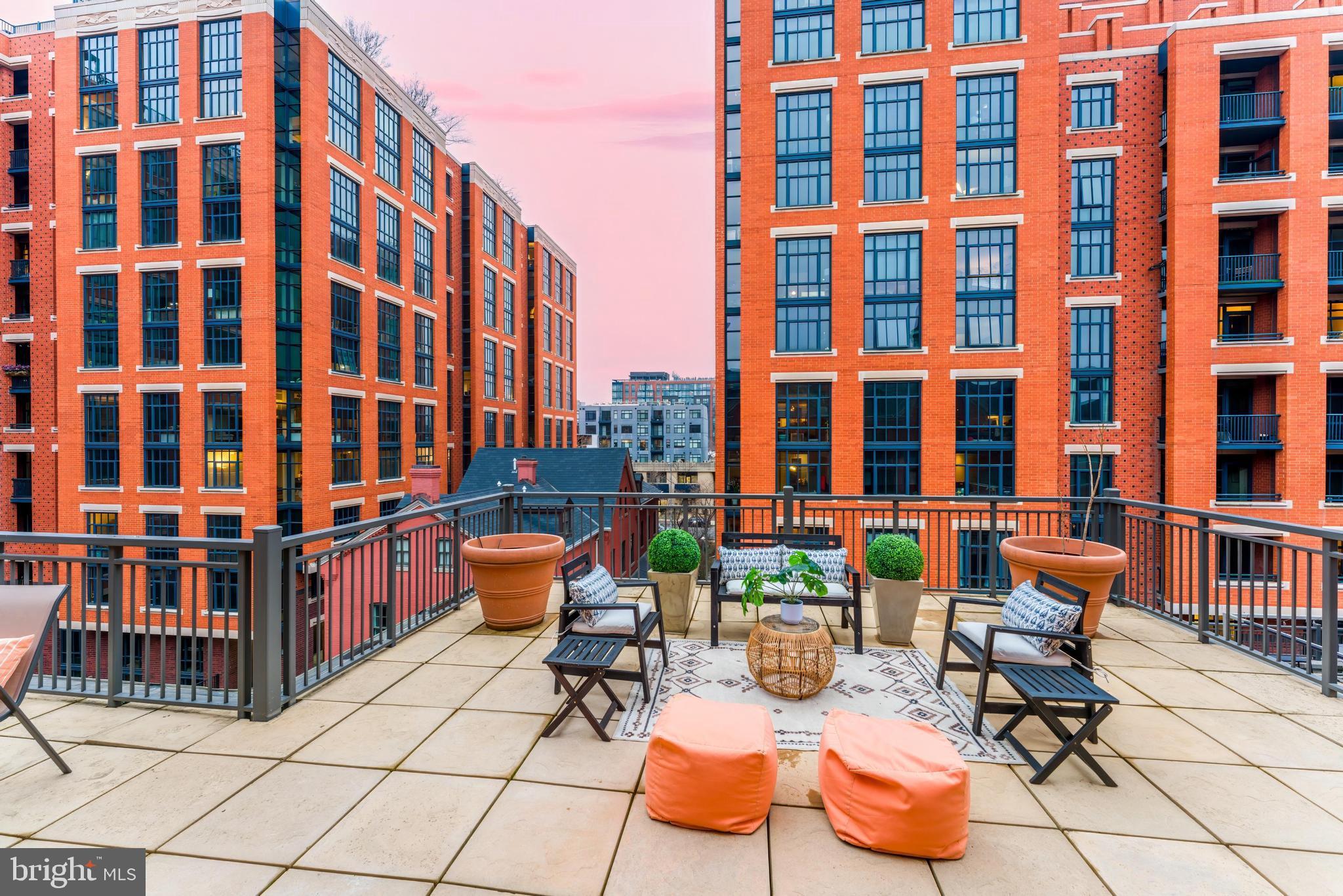 215 I Street Northeast, Unit 401 Washington, DC 20002 - Photo 11 of 36 a building outdoor space with patio furniture and potted plants