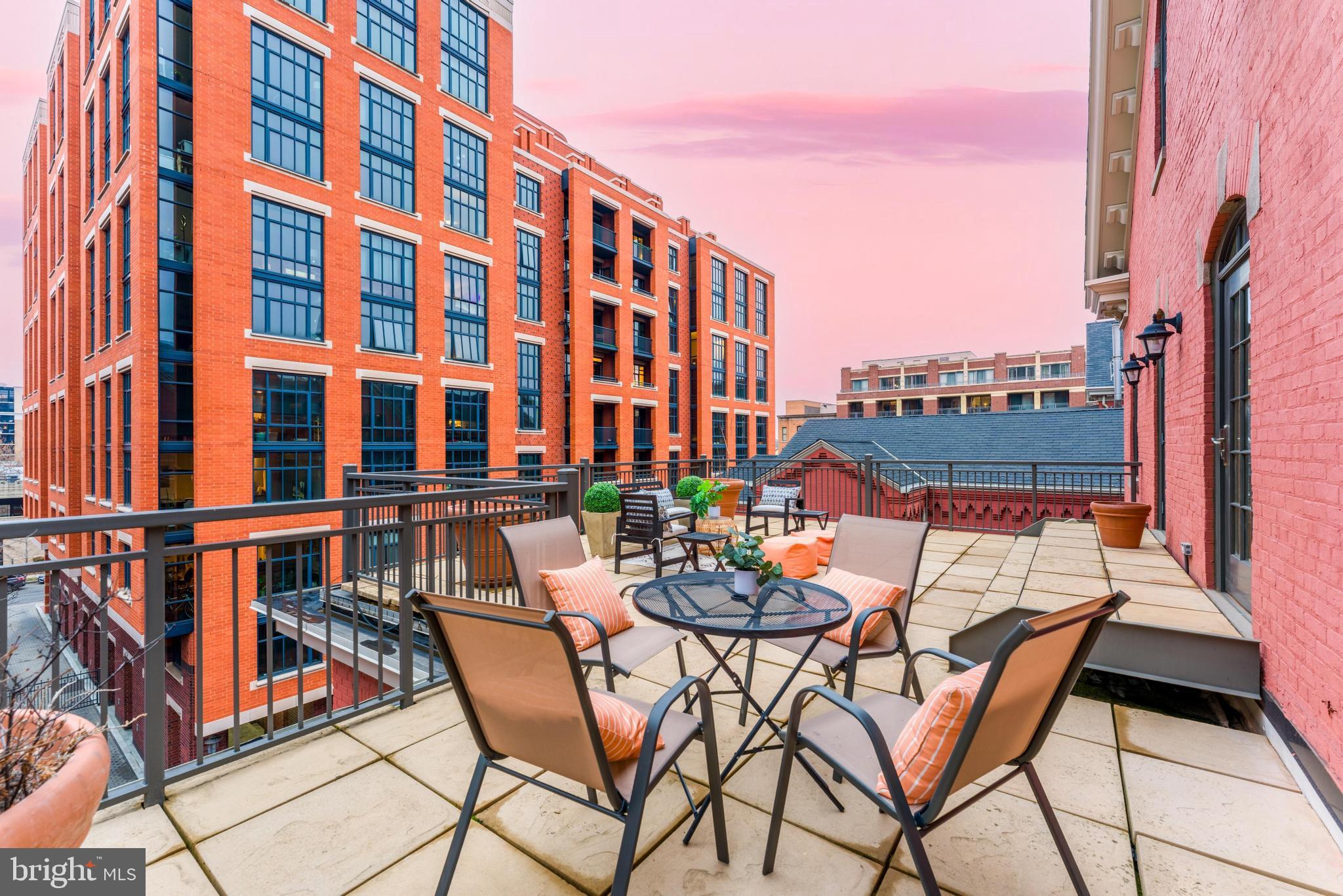 215 I Street Northeast, Unit 401 Washington, DC 20002 - Photo 12 of 36 a view of swimming pool with outdoor seating and city view