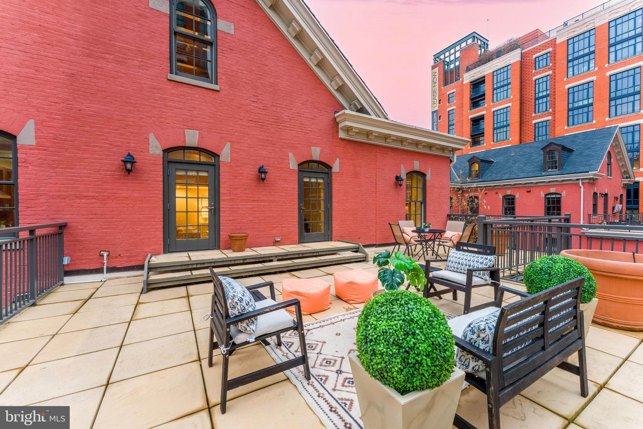 215 I Street Northeast, Unit 401 Washington, DC 20002 - Photo 14 of 36 a view of a chairs and table in the patio