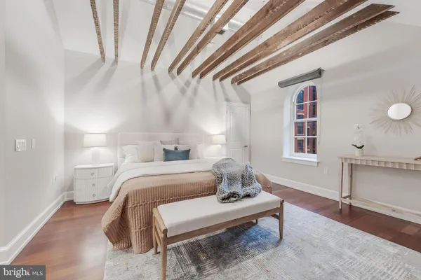 a room with a bed and a window