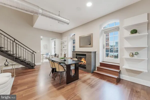 a view of livingroom with furniture fireplace and window