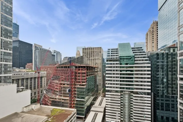 a view of city with tall buildings