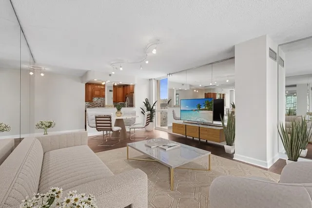 a kitchen with stainless steel appliances granite countertop a stove and a wooden cabinets