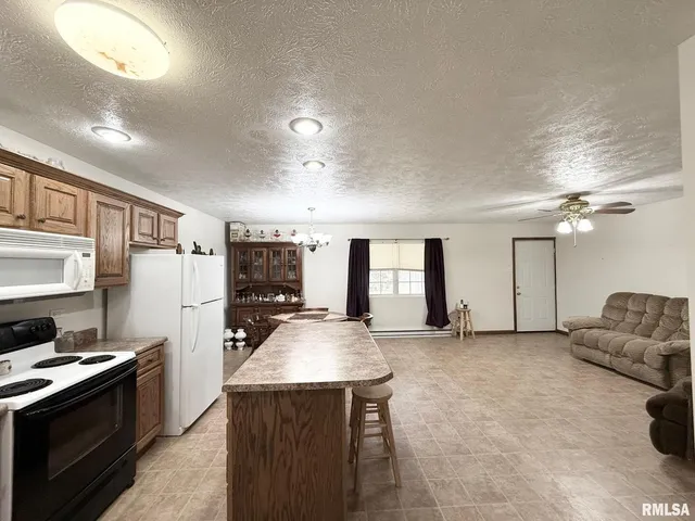 an empty room with a empty space and windows