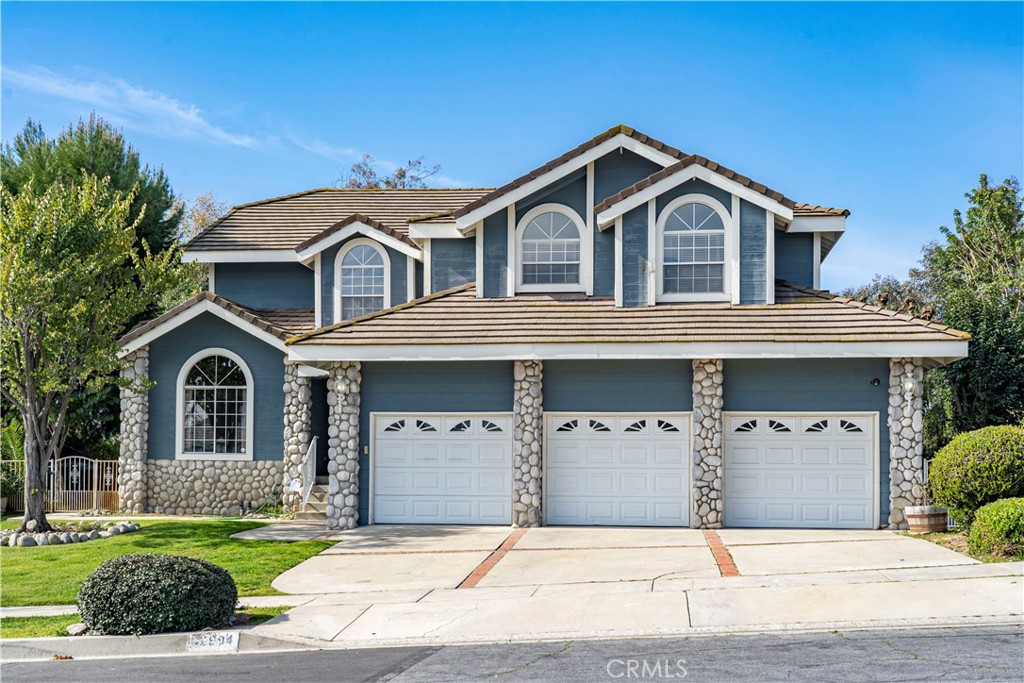 12994 Rimrock Avenue Chino Hills, CA 91709 - Photo 1 of 1 a front view of a house with a yard and garage