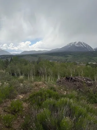 a view of a lake with mountains in the background