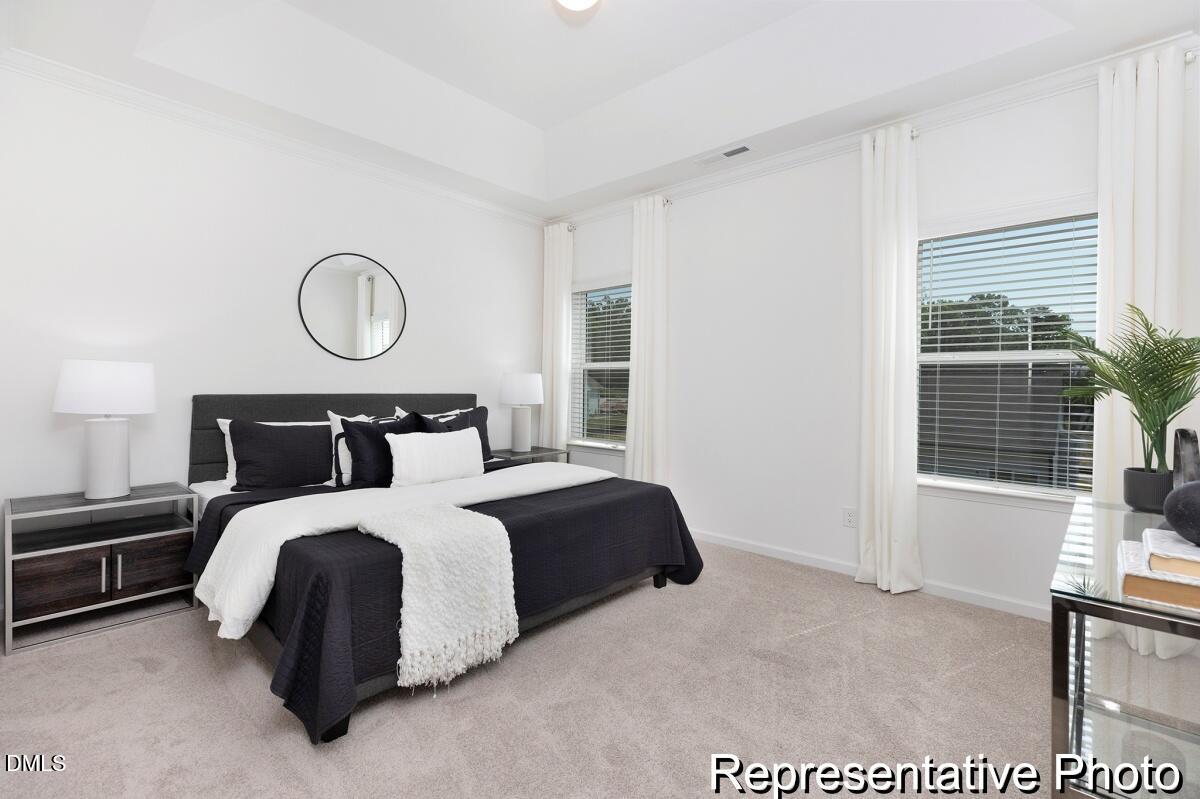 81 Cedarbranch Way, Unit 186P Dunn, NC 28334 - Photo 11 of 15 a bedroom with bed and a window