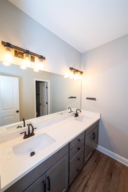 132 Addie Way Tuscola, TX 79562 - Photo 25 of 37 a bathroom with a double vanity sink and mirror