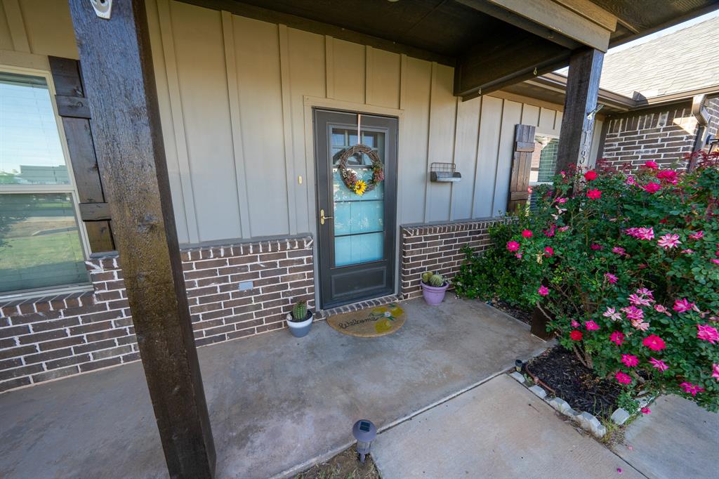 132 Addie Way Tuscola, TX 79562 - Photo 3 of 37 a backyard of a house with flowers