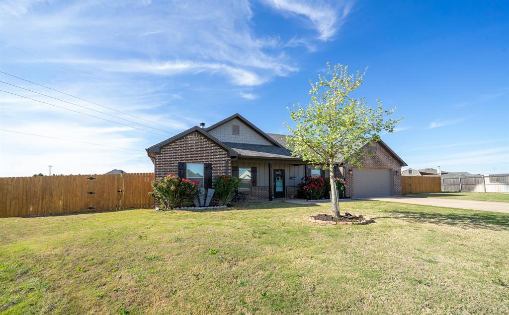 132 Addie Way Tuscola, TX 79562 - Photo 34 of 37 a front view of house with yard and trees in the background
