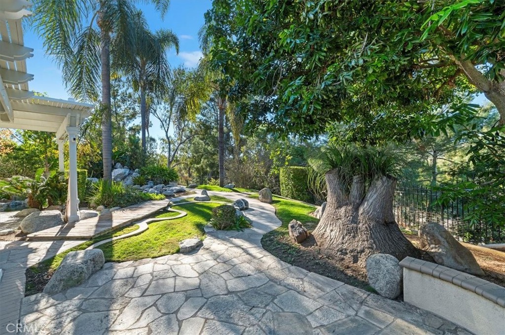 8 Nidden Irvine, CA 92603 - Photo 54 of 77 a view of a swimming pool with a patio and a yard