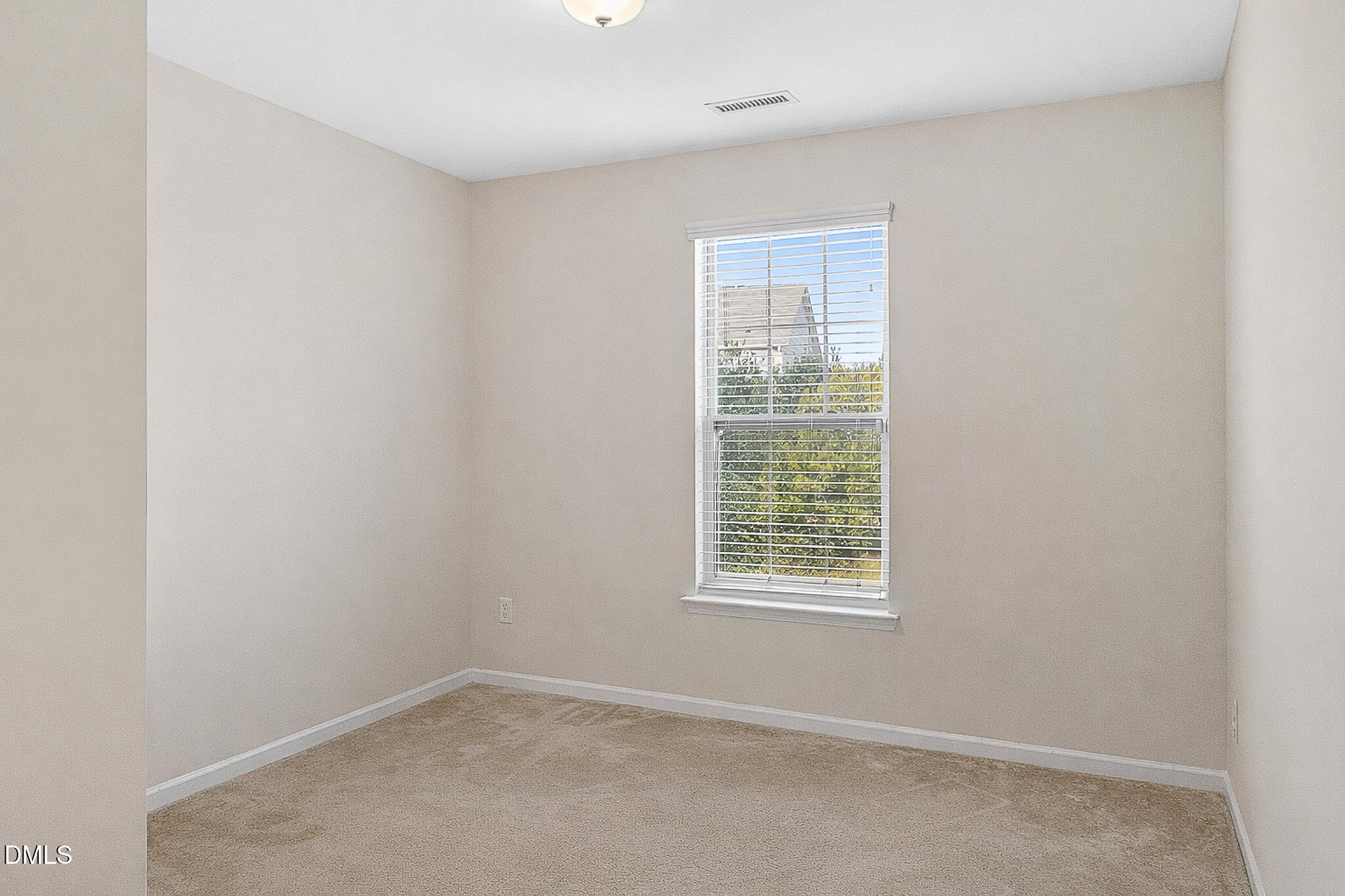 4249 Saubranch Hill Street Raleigh, NC 27616 - Photo 11 of 31 an empty room with a window