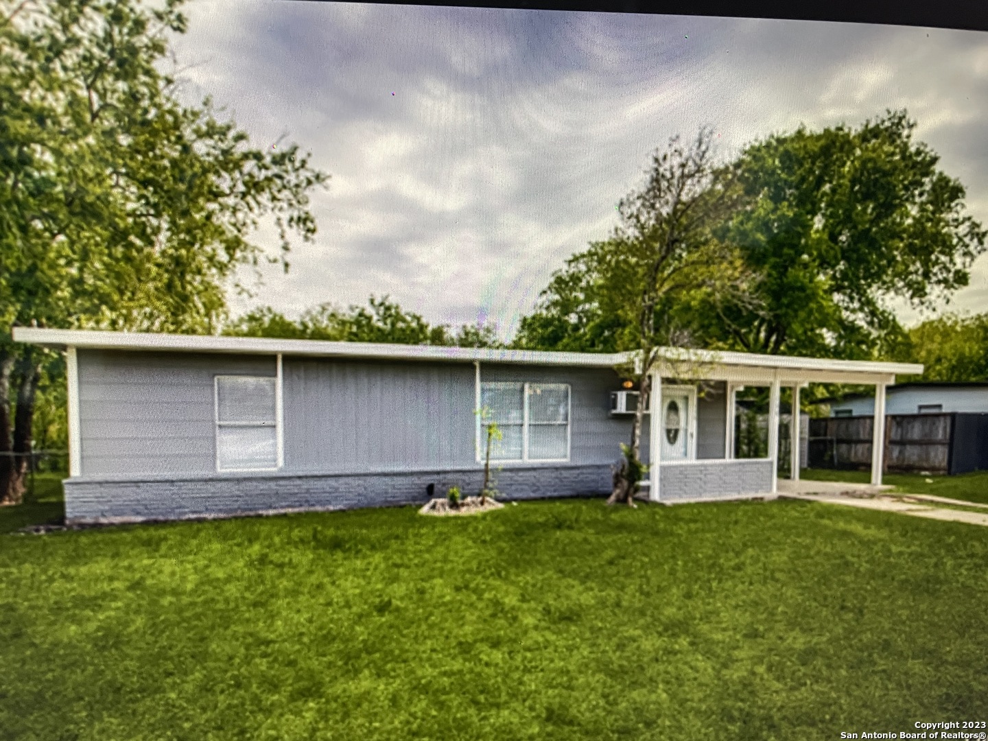 front view of a house with a yard