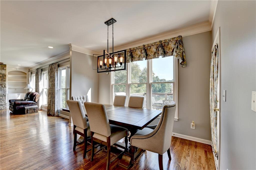 964 Fairview Club Circle Dacula, GA 30019 - Photo 11 of 47 a view of a dining room with furniture window and wooden floor