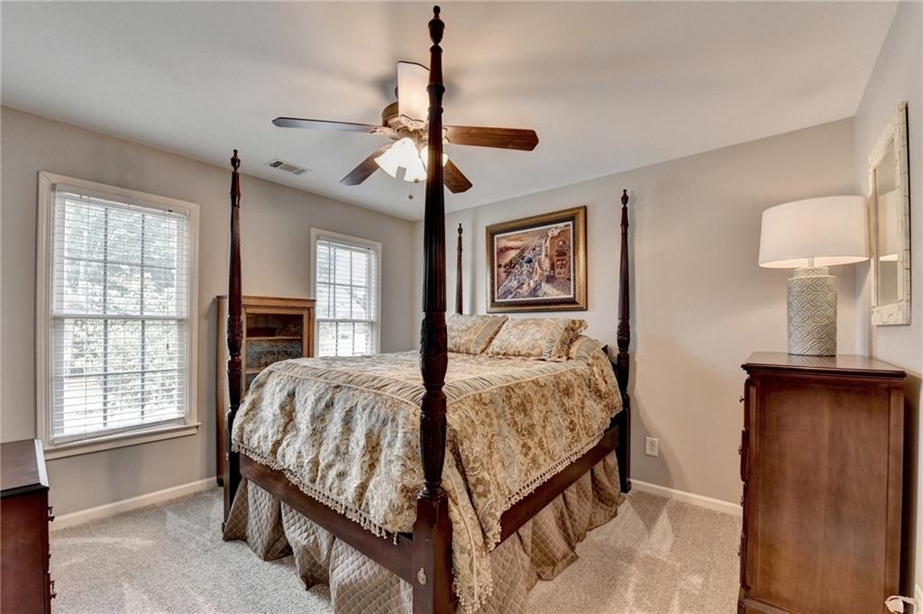 964 Fairview Club Circle Dacula, GA 30019 - Photo 26 of 47 a bedroom with a bed and a window