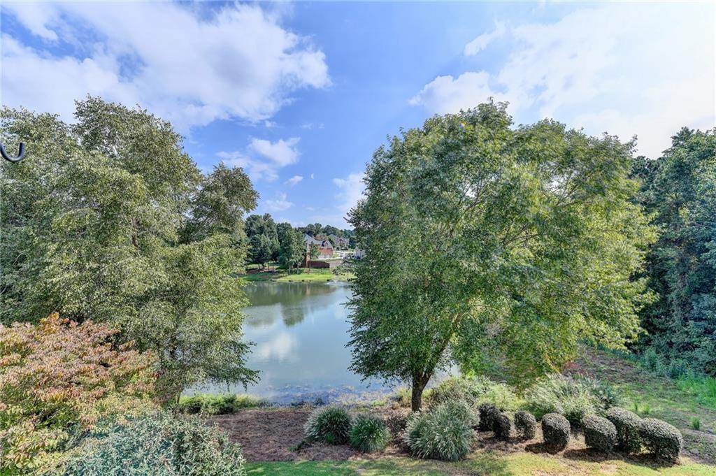 964 Fairview Club Circle Dacula, GA 30019 - Photo 38 of 47 a view of a lake with houses