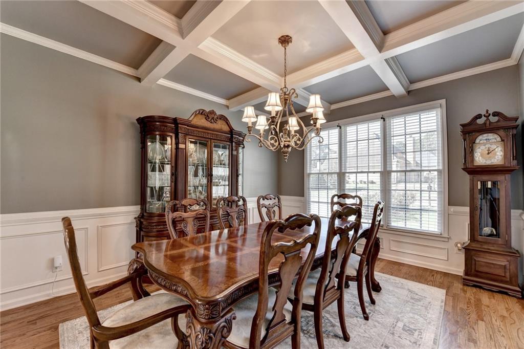 964 Fairview Club Circle Dacula, GA 30019 - Photo 5 of 47 a view of a dining room with furniture a chandelier and wooden floor
