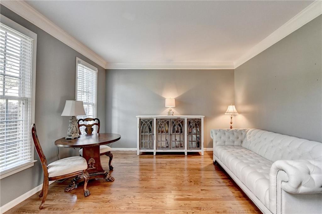 964 Fairview Club Circle Dacula, GA 30019 - Photo 6 of 47 a living room with furniture and a wooden floor