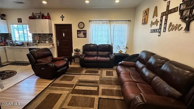 a living room with furniture and a fireplace