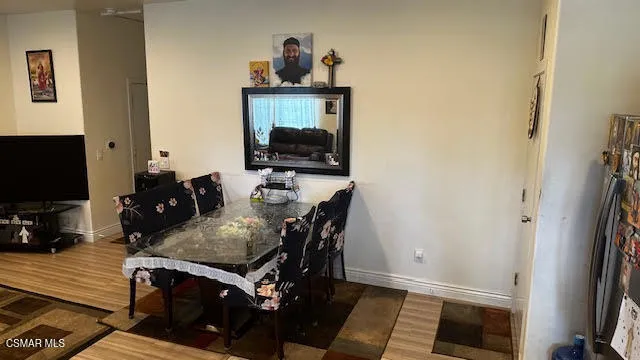 a view of a workspace with furniture and a flat screen tv