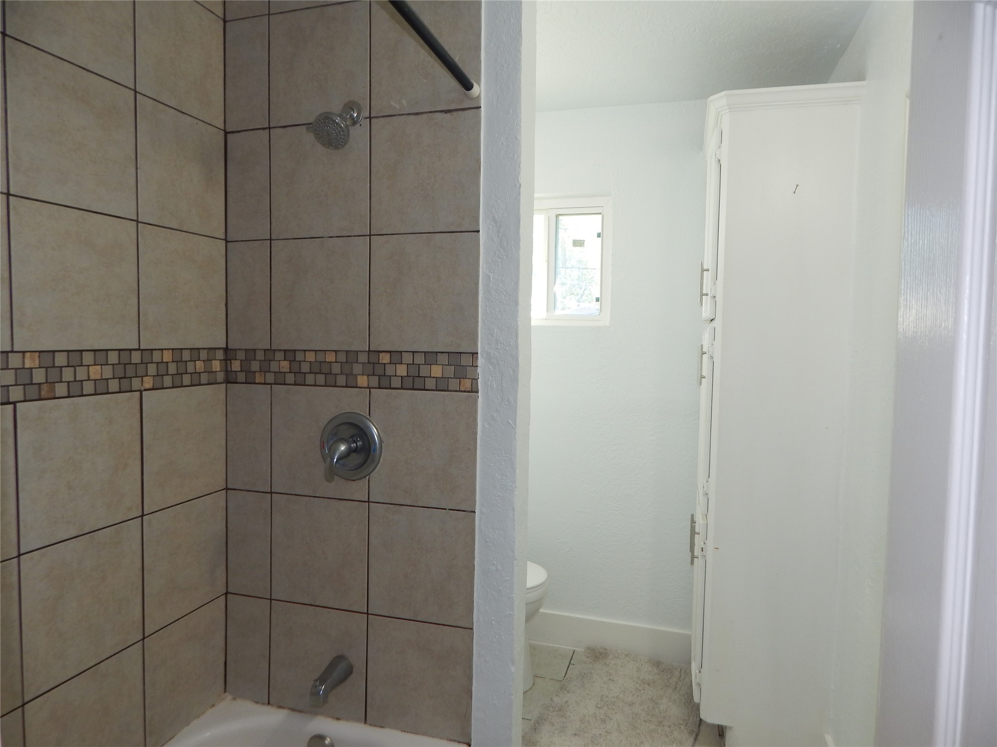 206 Arnett Lane Houston, TX 77037 - Photo 28 of 28 a bathroom with a shower